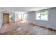 Spacious living room featuring a combination of wood flooring and carpet for a unique touch at 4025 Stratfield Dr, New Port Richey, FL 34652