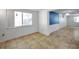 Bright room featuring tiled floors and large window for natural light at 4025 Stratfield Dr, New Port Richey, FL 34652