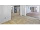 Open plan view of the kitchen and dining area in a well lit room at 4025 Stratfield Dr, New Port Richey, FL 34652
