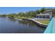 Waterfront view of canal, boat docks, and park building in New Port Richey at 4025 Stratfield Dr, New Port Richey, FL 34652