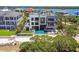 An aerial view showcases a luxury waterfront property with a modern design, pool, and meticulously landscaped grounds at 4333 Harborpointe Dr, Port Richey, FL 34668