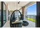 Relaxing balcony with hanging chairs and stunning waterfront views at 4333 Harborpointe Dr, Port Richey, FL 34668