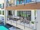 Outdoor balcony featuring dining and lounge seating, with views of the pool below at 4333 Harborpointe Dr, Port Richey, FL 34668