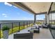 This ocean-view balcony includes an outdoor living space with seating and planters at 4333 Harborpointe Dr, Port Richey, FL 34668