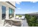 Outdoor balcony features water views, seating, and lush greenery for ultimate relaxation at 4333 Harborpointe Dr, Port Richey, FL 34668