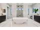 Modern bathroom with large tub, rain shower, and and sinks at 4333 Harborpointe Dr, Port Richey, FL 34668