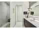 Modern bathroom featuring stone shower and dual sink vanity at 4333 Harborpointe Dr, Port Richey, FL 34668