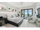 Modern bedroom with stylish decor, ocean views, and an outdoor balcony with seating at 4333 Harborpointe Dr, Port Richey, FL 34668