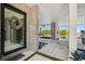 Elegant entrance featuring stone accents, a modern front door, and views of the luxurious outdoor space at 4333 Harborpointe Dr, Port Richey, FL 34668