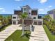 Modern waterfront home with lush landscaping, a multi-car garage, and exceptional architectural design at 4333 Harborpointe Dr, Port Richey, FL 34668