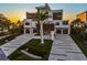 Stunning modern home boasting meticulous landscaping, multi-car garage, and distinctive architectural details at 4333 Harborpointe Dr, Port Richey, FL 34668