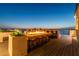 Inviting rooftop deck featuring a fire feature and bar seating for entertaining at 4333 Harborpointe Dr, Port Richey, FL 34668