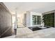 Modern foyer with tranquil water feature, contemporary art, and elegant stone accents, leading to the residence at 4333 Harborpointe Dr, Port Richey, FL 34668