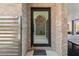 Welcoming front door with stone accents, offering a glimpse into the luxurious outdoor living space at 4333 Harborpointe Dr, Port Richey, FL 34668