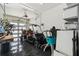 A spacious garage contains a golf cart and other outdoor recreational items, providing ample storage at 4333 Harborpointe Dr, Port Richey, FL 34668