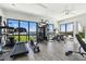Well-equipped home gym featuring a variety of exercise machines and stunning water views at 4333 Harborpointe Dr, Port Richey, FL 34668