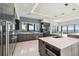 Spacious kitchen with stainless steel appliances and a view of the water at 4333 Harborpointe Dr, Port Richey, FL 34668