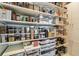 Walk-in pantry with well-organized shelves filled with an abundance of food at 4333 Harborpointe Dr, Port Richey, FL 34668