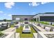 Rooftop deck featuring lounge seating, a fire pit, and bar with stools at 4333 Harborpointe Dr, Port Richey, FL 34668