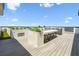 Spacious rooftop deck with grill, counter seating, and succulent planters at 4333 Harborpointe Dr, Port Richey, FL 34668