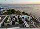 Expansive rooftop deck offering ocean views, hot tub, bar, and lounge area with a cozy fireplace at 4333 Harborpointe Dr, Port Richey, FL 34668