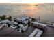 Luxury rooftop deck with a hot tub, fireplace, wet bar, and scenic sunset views at 4333 Harborpointe Dr, Port Richey, FL 34668