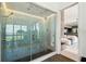 Stunning glass-enclosed shower features unique tile work and a built-in bench at 4333 Harborpointe Dr, Port Richey, FL 34668