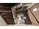 View looking up a modern wood staircase with unique pendant lighting at 4333 Harborpointe Dr, Port Richey, FL 34668