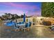 Beautiful backyard featuring an outdoor dining set, pool, and covered patio perfect for outdoor enjoyment at 4387 6Th Isle Dr, Hernando Beach, FL 34607