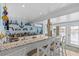 Bright bar area featuring beautiful granite countertops, lots of space, and decor at 4387 6Th Isle Dr, Hernando Beach, FL 34607