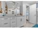 Bathroom vanity with marble countertop, mirror, and stylish decor elements at 4387 6Th Isle Dr, Hernando Beach, FL 34607