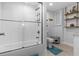 Bathroom with a shower/tub, toilet, shelf, and stylish tile, ensuring a comfortable experience at 4387 6Th Isle Dr, Hernando Beach, FL 34607