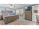 Comfortable bedroom with a ceiling fan, sliding glass doors, and an ocean view at 4387 6Th Isle Dr, Hernando Beach, FL 34607