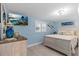 Bedroom with wood-look flooring, beachy decor, and TV, for relaxed viewing at 4387 6Th Isle Dr, Hernando Beach, FL 34607