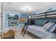 Bunk bedroom with TV and playful decor, creating a fun and inviting space at 4387 6Th Isle Dr, Hernando Beach, FL 34607