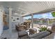 Cozy covered patio with comfortable seating, providing a perfect outdoor living space with relaxing water views at 4387 6Th Isle Dr, Hernando Beach, FL 34607