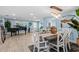 Bright dining room with a piano and coastal-inspired decor for relaxed entertaining at 4387 6Th Isle Dr, Hernando Beach, FL 34607