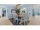 Dining room with modern lighting, coastal decor, and an inviting atmosphere at 4387 6Th Isle Dr, Hernando Beach, FL 34607