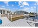 Waterfront dock is equipped with boat lifts to take your boat out on the open waters at 4387 6Th Isle Dr, Hernando Beach, FL 34607