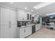 Bright kitchen with modern appliances, white cabinets, and granite countertops at 4387 6Th Isle Dr, Hernando Beach, FL 34607