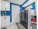 Well-organized laundry room with modern washer and dryer and plenty of storage space at 4387 6Th Isle Dr, Hernando Beach, FL 34607