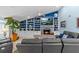 A fireplace, TV, built-in shelving, comfortable seating, and coastal-themed decor enhances the living room's cozy ambiance at 4387 6Th Isle Dr, Hernando Beach, FL 34607