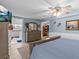 This main bedroom features a ceiling fan, dresser, and large TV for a relaxing atmosphere at 4387 6Th Isle Dr, Hernando Beach, FL 34607