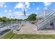 Waterfront home with a paved patio, dock, and direct water access and a staircase leading to a second story deck at 4387 6Th Isle Dr, Hernando Beach, FL 34607