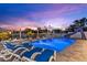 Lovely pool and patio area with lounge chairs and a slide, perfect for relaxing and entertaining outdoors at 4387 6Th Isle Dr, Hernando Beach, FL 34607
