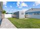 Backyard with a cozy shed featuring great sunlight and proximity to lush greenery at 4387 6Th Isle Dr, Hernando Beach, FL 34607