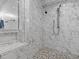 This shower features beautiful marble tiling, a pebble floor, and a built in step at 4387 6Th Isle Dr, Hernando Beach, FL 34607