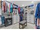 This walk-in closet offers custom organizers, drawers, safe, and sitting area at 4387 6Th Isle Dr, Hernando Beach, FL 34607
