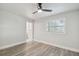 Bedroom featuring wood flooring and a view to the updated bathroom at 4482 Kingston Dr, Hernando Beach, FL 34607