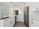 Bright kitchen with white cabinets, stainless steel appliances, and a large kitchen island at 4482 Kingston Dr, Hernando Beach, FL 34607